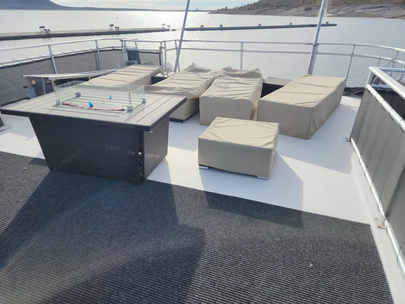 Slide: The Image of Top deck of a 2008 Sumerset Houseboat 20' x 100' with lounge seating and a fire pit. - 6