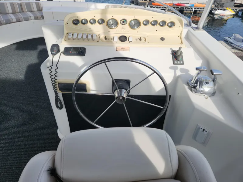 Slide: The Image of Steering console of a 2008 Sumerset Houseboat 20' x 100' with control panel and gauges. - 9