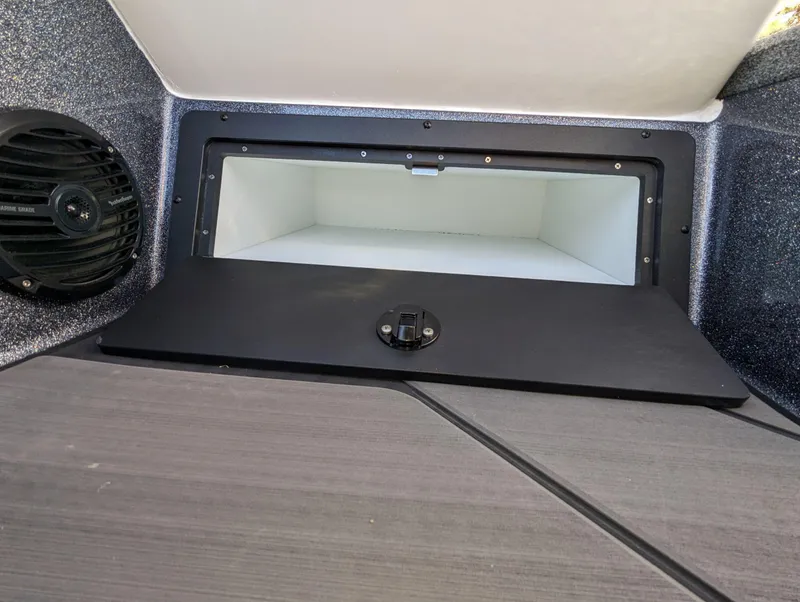 Slide: The Image of 2025 Lund 202 Pro-V GL boat storage compartment with speaker. - 13