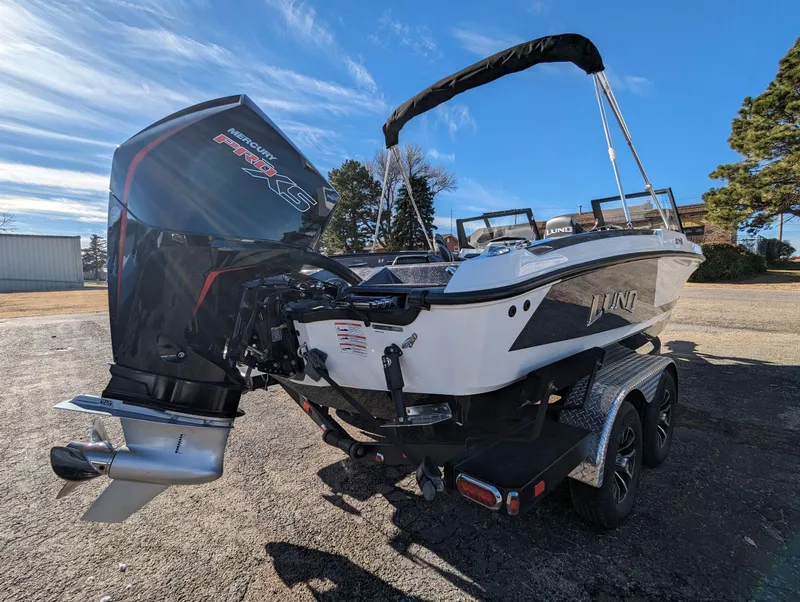 Slide: The Image of 2025 Lund 202 Pro-V GL boat with Mercury Pro XS outboard motor. - 2