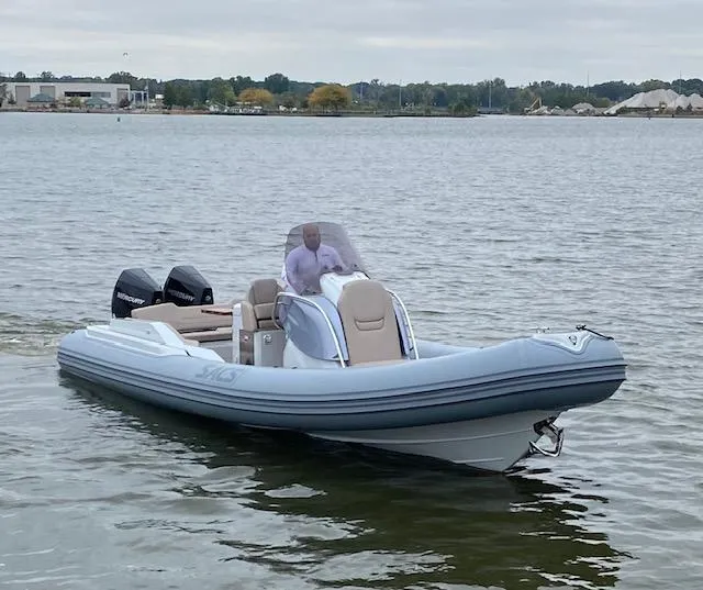 Slide: The Image of 2024 SACS Strider 900 inflatable boat on calm water. - 4