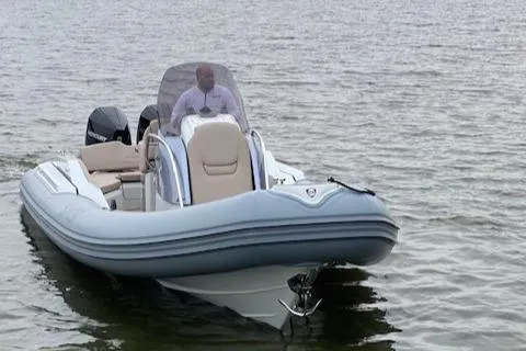 Slide: The Image of 2024 SACS Strider 900 inflatable boat on water. - 5