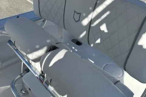 Slide: The Image of 2024 Sea Fox 248 Commander boat with white cushioned seating and diamond stitching. - 10