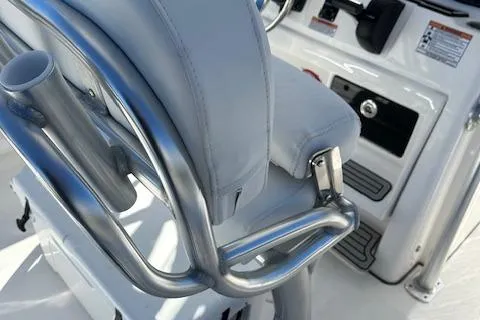 Slide: The Image of 2024 Sea Fox 248 Commander boat interior with cushioned seating and stainless steel railings. - 14