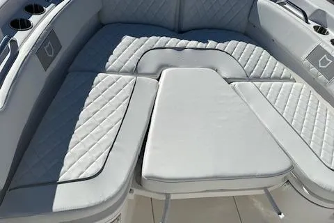 Slide: The Image of 2024 Sea Fox 248 Commander boat with cushioned seating area. - 5
