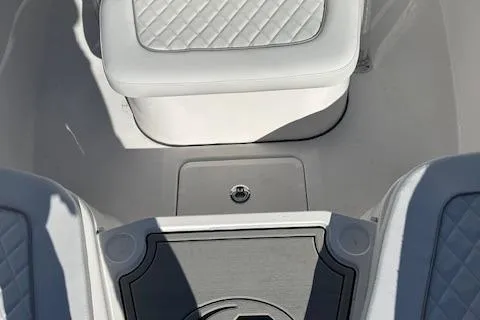 Slide: The Image of 2024 Sea Fox 248 Commander boat interior with cushioned seating and storage. - 7