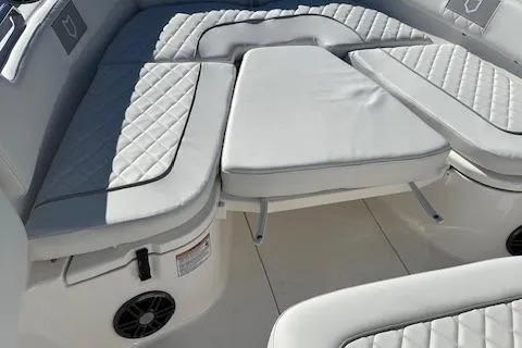 Slide: The Image of 2024 Sea Fox 248 Commander boat with cushioned seating and storage compartments. - 8