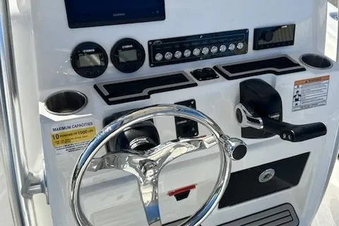 Slide: The Image of 2024 Sea Fox 248 Commander boat dashboard with steering wheel and control panel. - 9