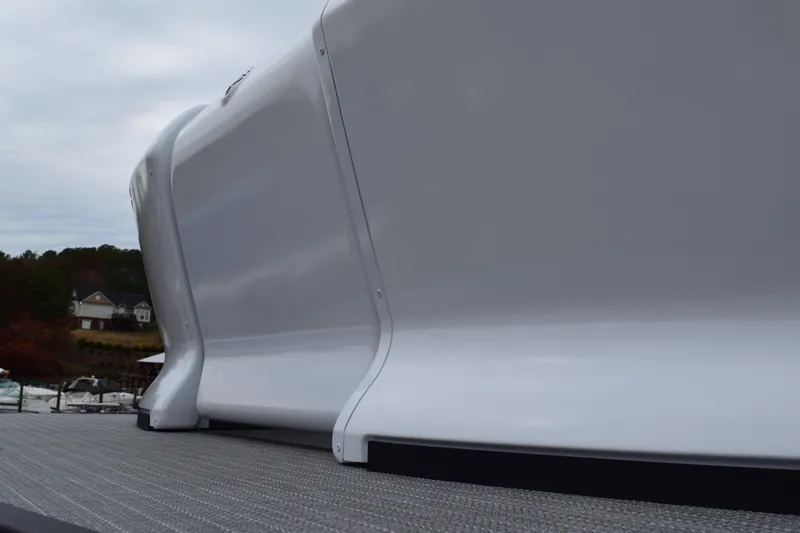 Slide: The Image of 2024 Manitou 22' Cruise Switchback Stealth pontoon boat close-up. - 12