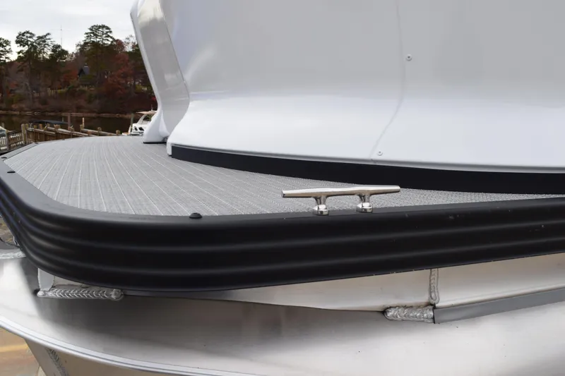 Slide: The Image of 2024 Manitou 22' Cruise Switchback Stealth boat deck with cleat. - 14