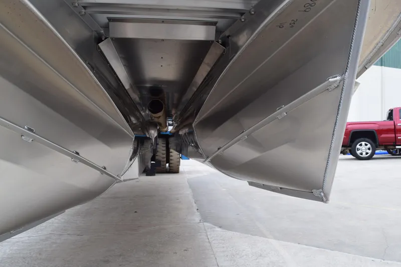 Slide: The Image of Underneath view of 2024 Manitou 22' Cruise Switchback Stealth pontoon boat. - 15