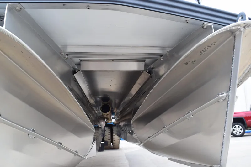 Slide: The Image of 2024 Manitou 22' Cruise Switchback Stealth pontoon boat undercarriage view. - 16