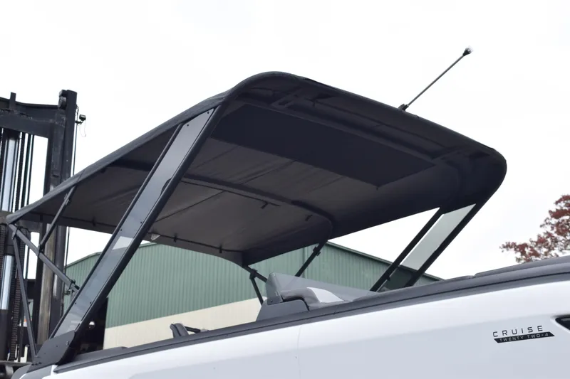 Slide: The Image of 2024 Manitou 22' Cruise Switchback Stealth boat with canopy. - 18