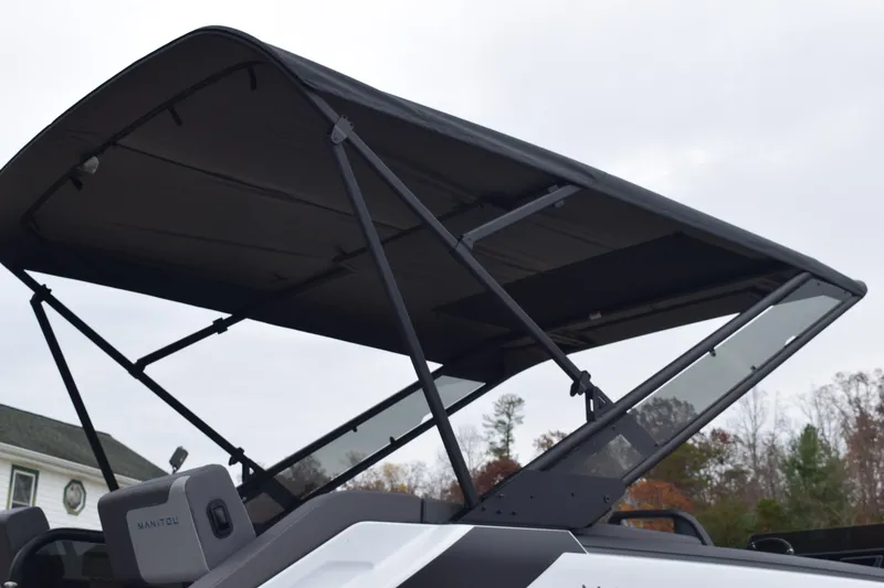 Slide: The Image of 2024 Manitou 22' Cruise Switchback Stealth boat with canopy. - 19