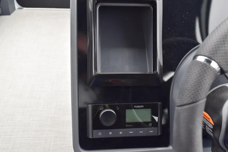 Slide: The Image of 2024 Manitou 22' Cruise Switchback Stealth dashboard with Fusion stereo system. - 28