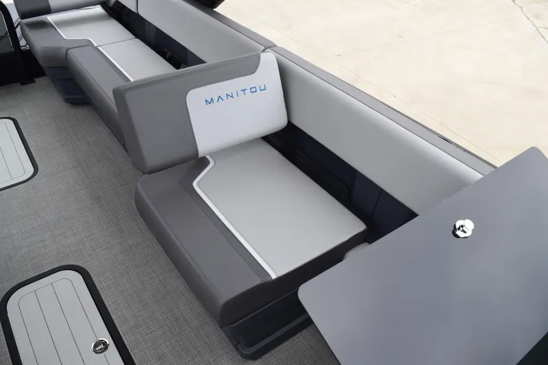 Slide: The Image of 2024 Manitou 22' Cruise Switchback Stealth boat interior seating. - 34