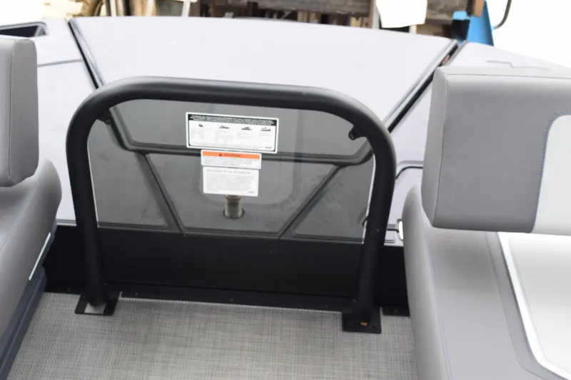 Slide: The Image of 2024 Manitou 22' Cruise Switchback Stealth boat interior with safety gate. - 37