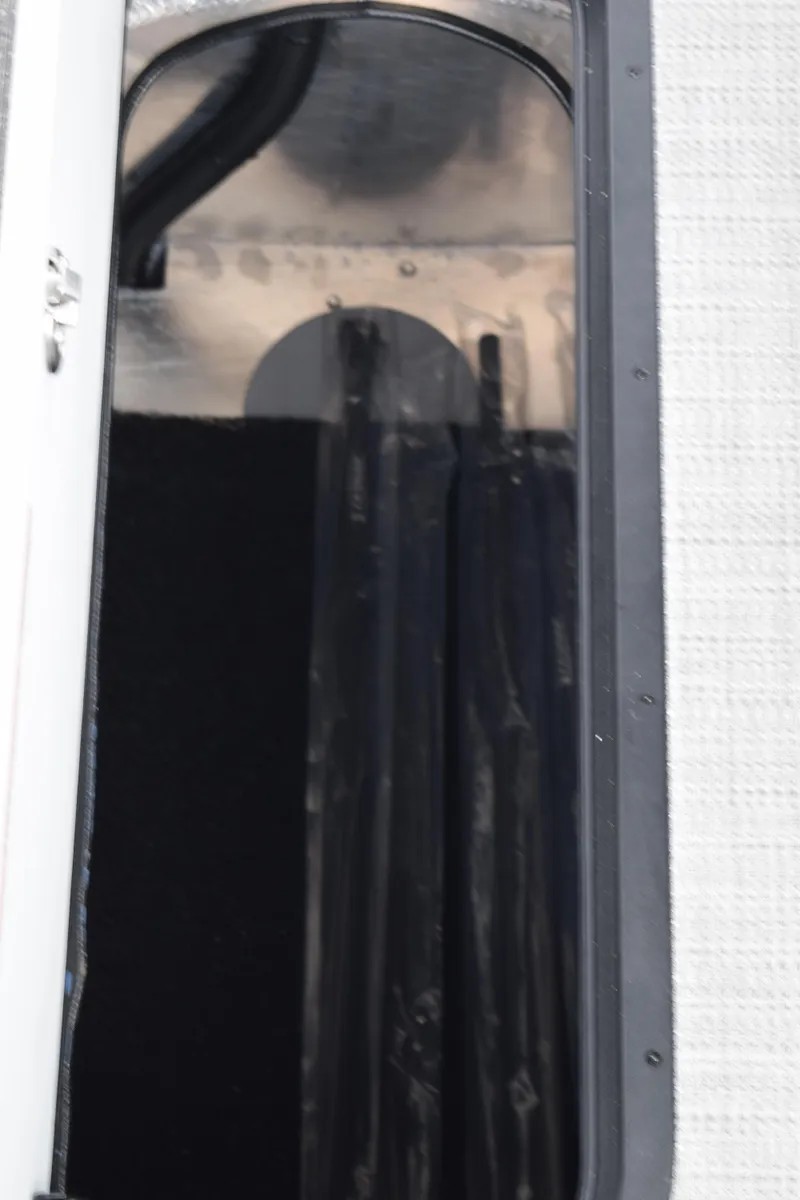 Slide: The Image of 2024 Manitou 22' Cruise Switchback Stealth interior compartment detail. - 42