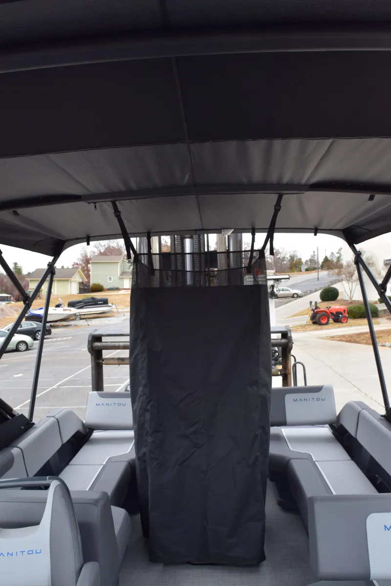 Slide: The Image of 2024 Manitou 22' Cruise Switchback Stealth pontoon boat interior. - 43