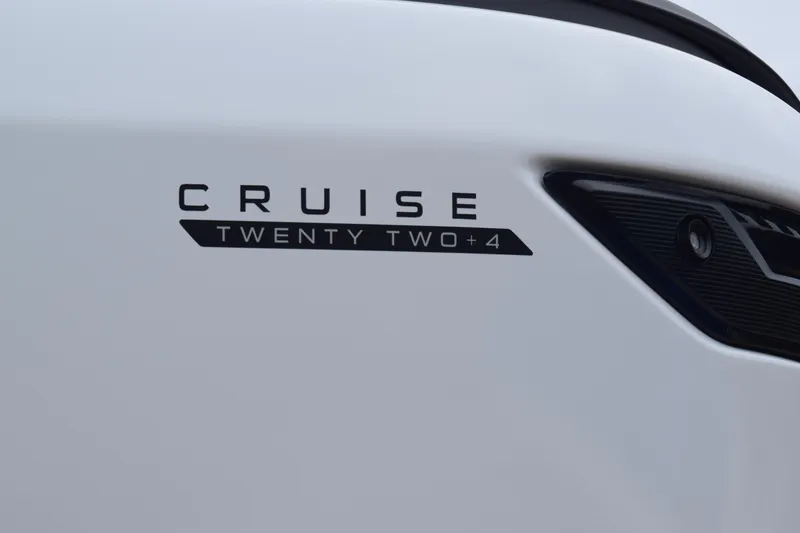 Slide: The Image of Close-up of 2024 Manitou 22' Cruise Switchback Stealth logo. - 5