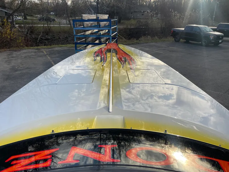 Slide: The Image of 2007 Donzi 38 ZR speedboat with vibrant graphics on the deck. - 10