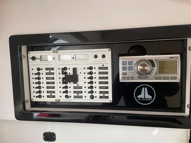 Slide: The Image of Control panel and audio system of a 2007 Donzi 38 ZR boat. - 16