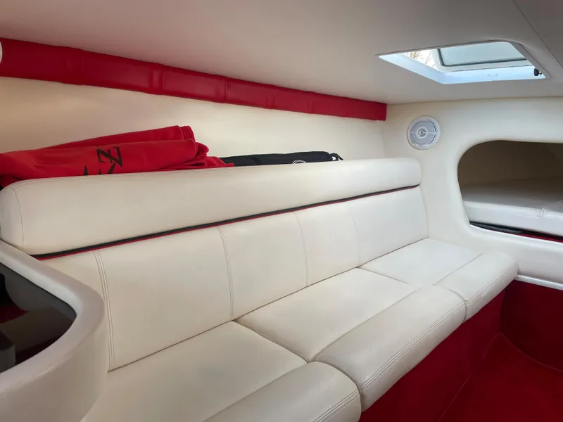 Slide: The Image of Interior of 2007 Donzi 38 ZR boat with white and red seating. - 19
