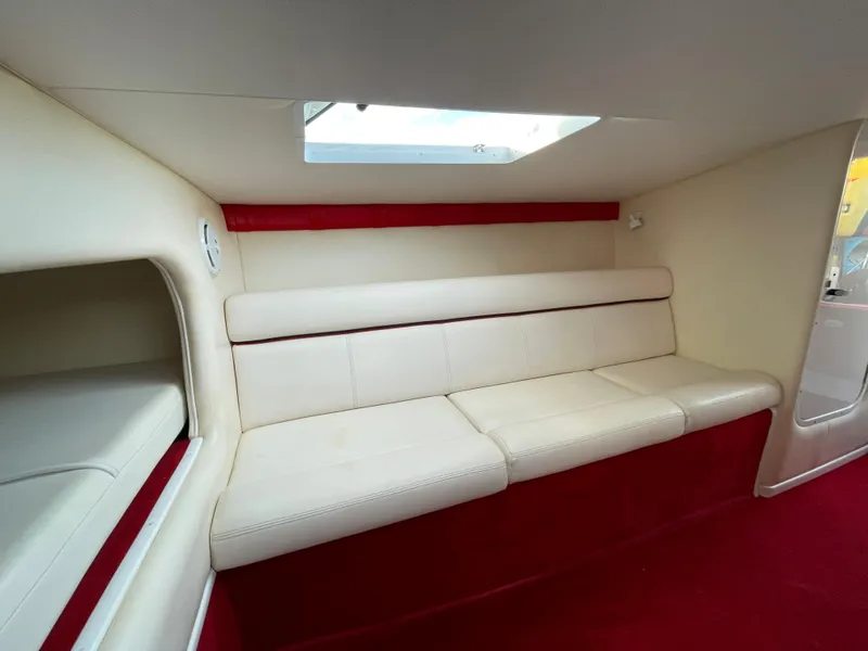 Slide: The Image of Interior of a 2007 Donzi 38 ZR boat with cream and red seating. - 22
