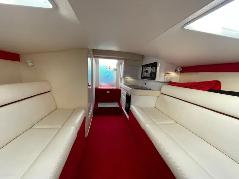 Slide: The Image of Interior of 2007 Donzi 38 ZR boat with white and red seating. - 23