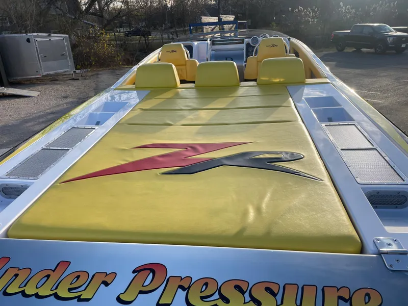 Slide: The Image of 2007 Donzi 38 ZR speedboat with yellow seating and Under Pressure decal. - 24