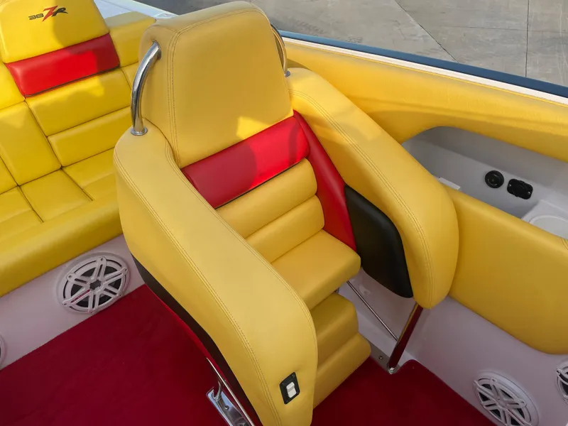 Slide: The Image of 2007 Donzi 38 ZR boat with yellow and red interior seating. - 32