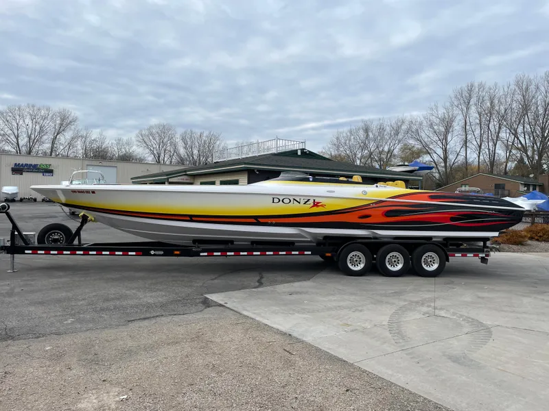 Slide: The Image of 2007 Donzi 38 ZR speedboat on a trailer, parked outdoors. - 5