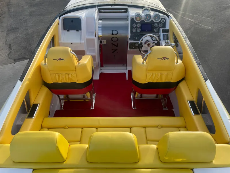 Slide: The Image of 2007 Donzi 38 ZR boat interior with yellow seats and red carpet. - 9