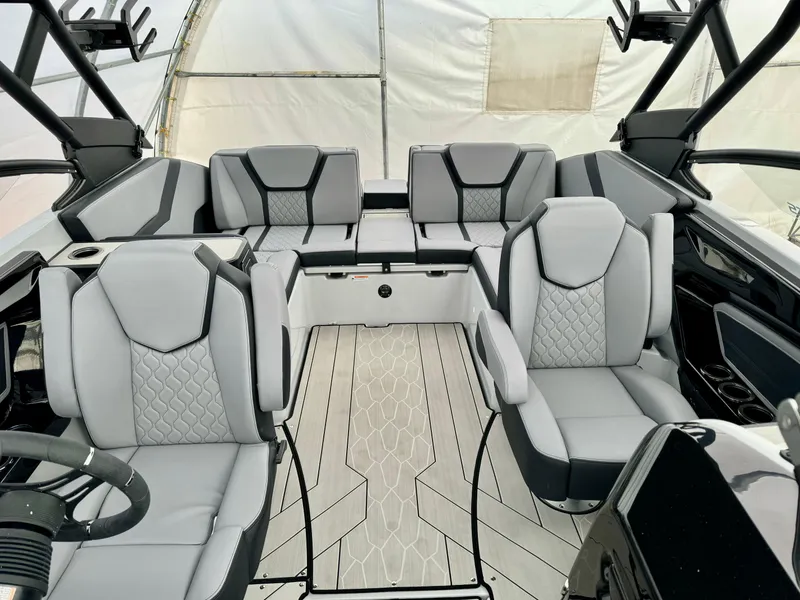 Slide: The Image of 2024 Yamaha Boats 255 XE interior with modern seating and sleek design. - 10