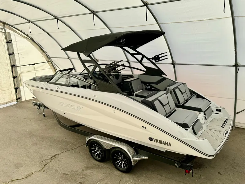 Slide: The Image of 2024 Yamaha Boats 255 XE in a covered storage area. - 12