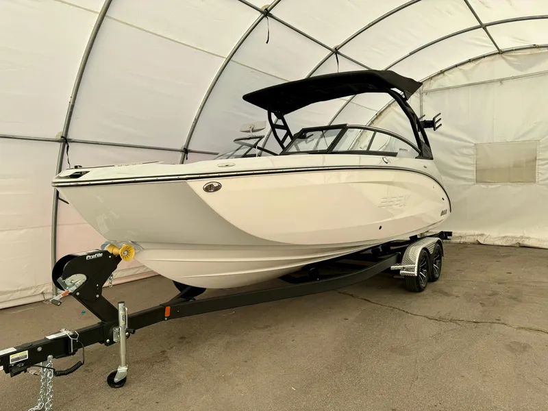 Slide: The Image of 2024 Yamaha Boats 255 XE in a covered storage area. - 3