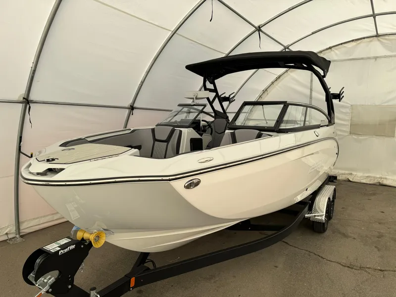 Slide: The Image of 2024 Yamaha Boats 255 XE in a covered storage area. - 4