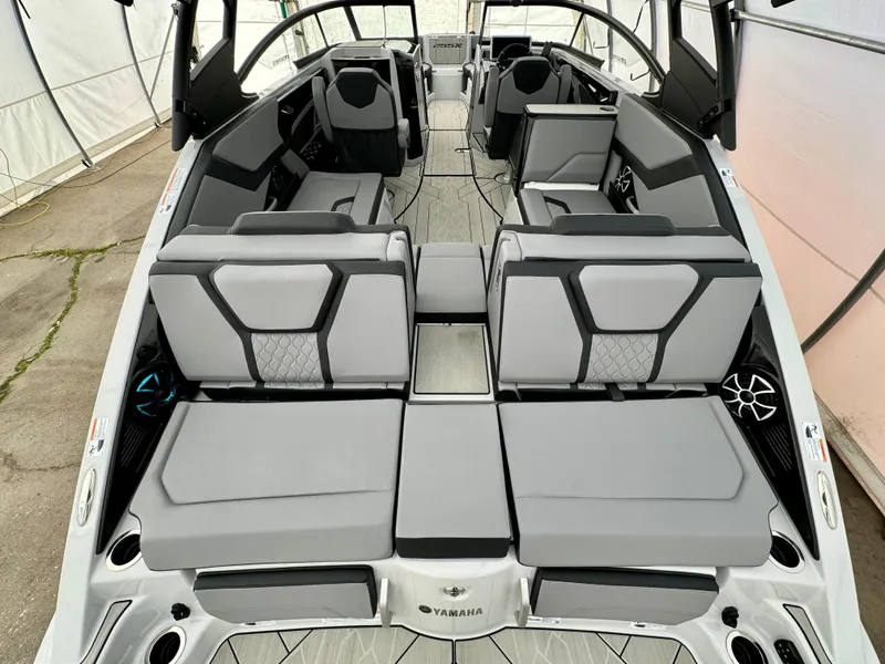 Slide: The Image of 2024 Yamaha Boats 255 XE interior with luxurious seating and modern design. - 6