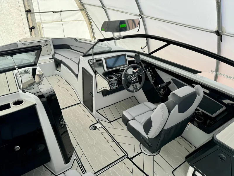 Slide: The Image of 2024 Yamaha Boats 255 XE interior cockpit with modern dashboard and seating. - 8