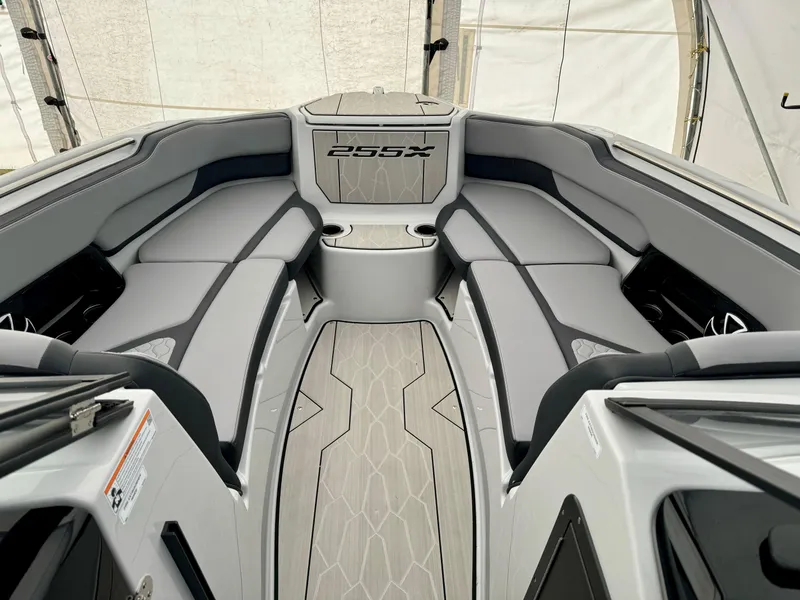 Slide: The Image of 2024 Yamaha Boats 255 XE interior with luxurious seating and modern design. - 9