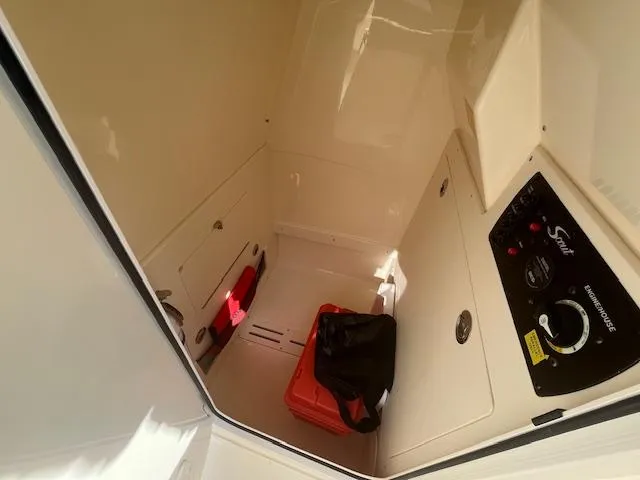 Slide: The Image of Interior cabin of 2023 Scout 215XSF boat with storage compartments. - 19