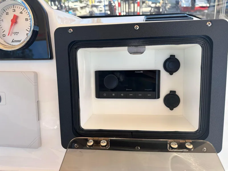 Slide: The Image of 2023 NauticStar 191 Hybrid dashboard with control panel and gauge. - 10