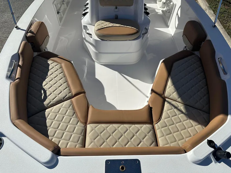 Slide: The Image of 2023 NauticStar 191 Hybrid boat with tan cushioned seating. - 3