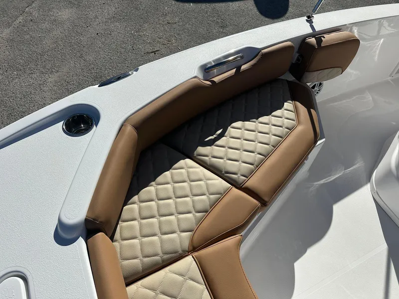 Slide: The Image of 2023 NauticStar 191 Hybrid boat with tan and beige cushioned seating. - 5