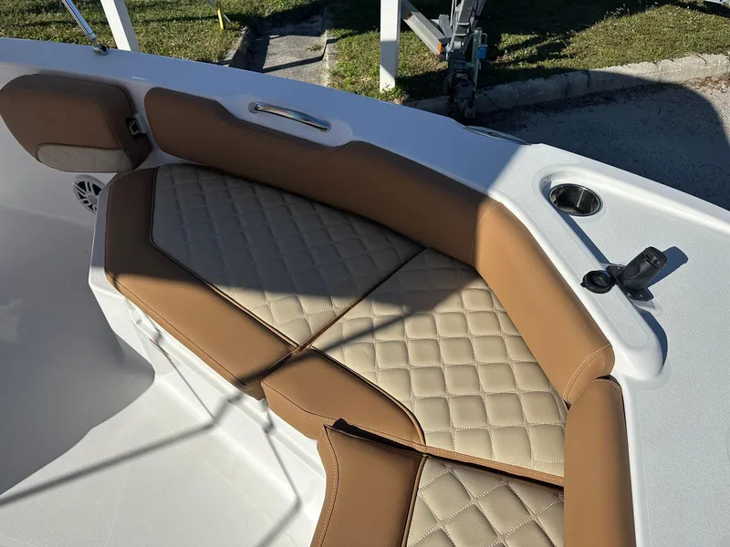 Slide: The Image of 2023 NauticStar 191 Hybrid boat with tan and beige cushioned seating. - 6