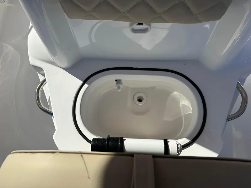 Slide: The Image of 2023 NauticStar 191 Hybrid boat livewell and seating area. - 7