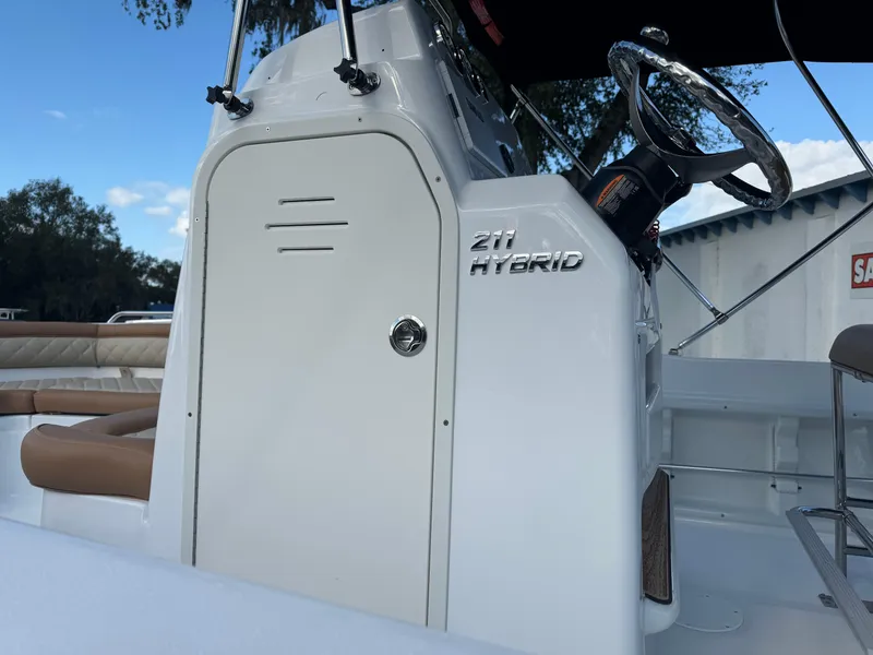 Slide: The Image of 2024 NauticStar 211 Hybrid boat console and steering wheel. - 8