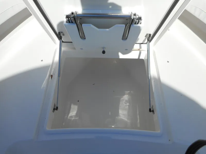 Slide: The Image of 2023 Regulator 34 boat storage compartment with open hatch. - 11