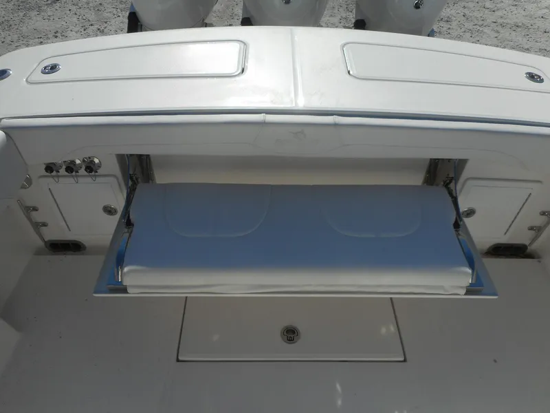 Slide: The Image of 2023 Regulator 34 boat with fold-out bench seat. - 17