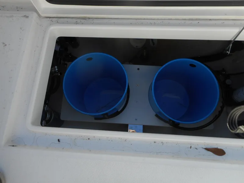 Slide: The Image of Livewell system on a 2023 Regulator 34 boat with dual blue buckets. - 18